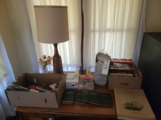 Hardbacks, early books, small farm journals, lamp, outdoor flag