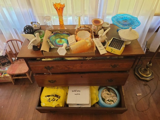 Contents of dresser, glassware, carnival bowl, thread holder, placemats, ash tray, decor items