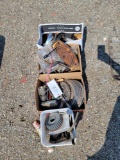 4 boxes of assorted bike parts, rotors, headlight rings, hardware