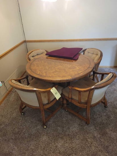 Drexel game table with 4 hip hugger chairs on casters and extra leaf
