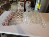 Assorted wine and drinking glasses, some Christmas themed