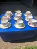 Nine hand painted matching cups and saucers - Bone China from England