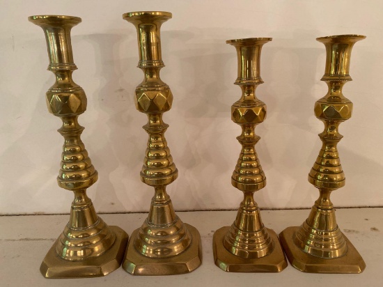 (2) Pairs old brass candlesticks, 10.75" & 9.75" tall.