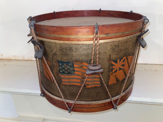 Old drum w/ flags of U. S. & three foreign countries. 13" dia. X 9" tall.