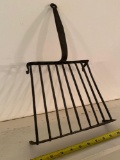 Hand wrought-iron footed trivet.