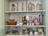Glassware, chinaware in cupboard.