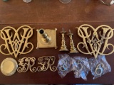 Brass Williamsburg trivets, brass candle holders & house numbers.