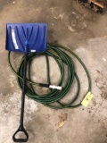 Water hose and snow shovel