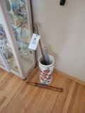 Floral umbrella stand with umbrellas and walking stick