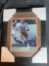 Greg Pruitt signed photo in 12.5 x 15.5 frame.
