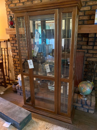 Oak lighted mirrored back curio cabinet