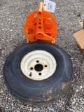 Small tire on rim, cord and reel