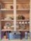 Contents of kitchen cabinet, top and bottom, mid century bread box and canister set