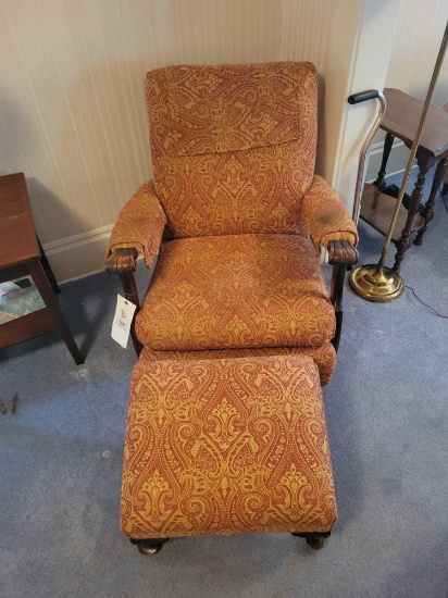 Upholstered wood framed armchair with foot stool