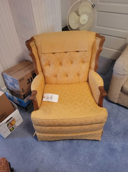 Yellow upholstered wood framed swivel chair