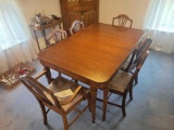 Mahogany dining room table with extra leaf and 6 chairs