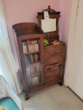 Antique oak secretary desk with books