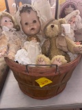 Basket with old dolls and teddy bear