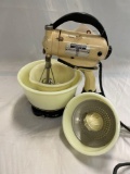 Hamilton Beach model D stand mixer with yellow milk glass bowls and juicer attachment