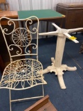 White metal table base and wrought iron chair