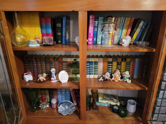 Lot of books, candles, and figurines