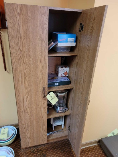 Pressboard cupboard with contents