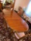 Drexel dining room table with 6 chairs, 1 captain chair, 3 leaves, 8 ft. long with leaves in