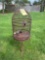 Antique rusted bird cage with base