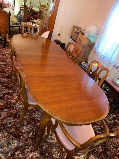 Drexel dining room table with 6 chairs, 1 captain chair, 3 leaves, 8 ft. long with leaves in