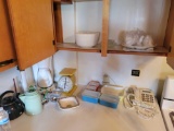 Contents of kitchen cabinets and countertop, Pyrex, enameled percolator, scale, mixing bowls