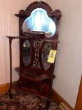 Ornate stand with mirror back and carvings, crack in mirror, 62 x 27 inches wide