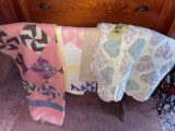 Oak quilt rack with 3 quilts