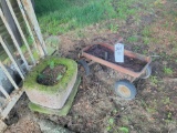 Metal wagon and stone planter