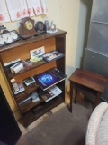 Phone stand, bookcase, pocket knives and clocks