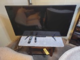 Toshiba 54 inch flat-screen TV with wood stand