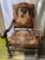 Early 19th Century needlepoint scene upholstered arm chair, claw footed, 42