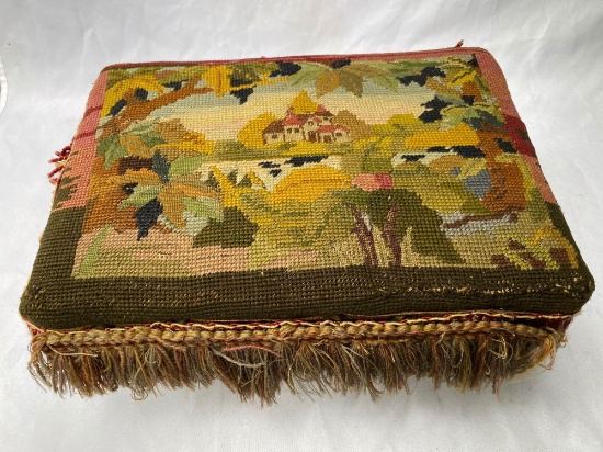 Antique needlepoint scene footstool, 14" wide x 7" tall.