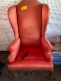 High back upholstered chair, one leg needs put back on.