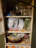 Contents of wall cupboard, plates, jars