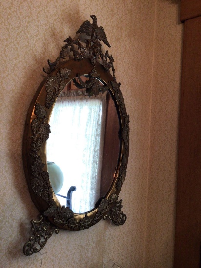 Ornate oval mirror