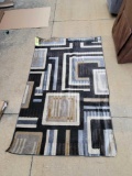 Medium woven rug 5 ft. x 7 ft. 3 in. (Tax)