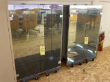 Pair of lighted glass door display cabinets w/ glass shelves.