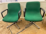 Pair swivel office chairs.