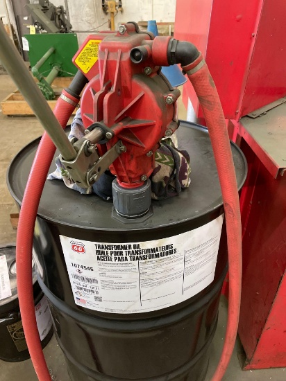 Barrel pump with empty drum.