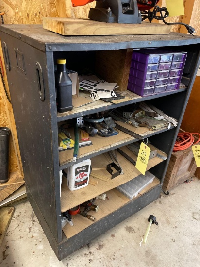 Metal cabinet on wheels and contents