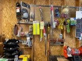 Extension cord, knee pads, zip ties, headphones, hardware, misc. contents on peg board