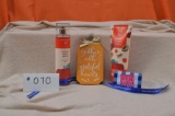 Bath & Body Works lotion and spray in Coconut Candy Apple, $25 gift card, an a pumpkin sign.