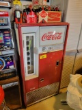 Early Coca-Cola machine with bottles