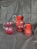 3 cranberry pitchers