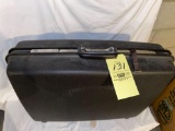 Samsonite hard suitcase.
